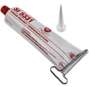  Valkoinen tuubi, jossa punaista tekstiä ja punainen korkki 